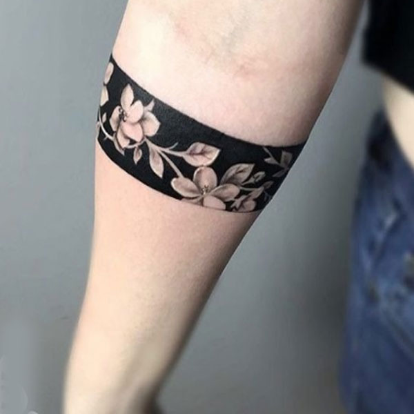 negative shading flower armband tattoo