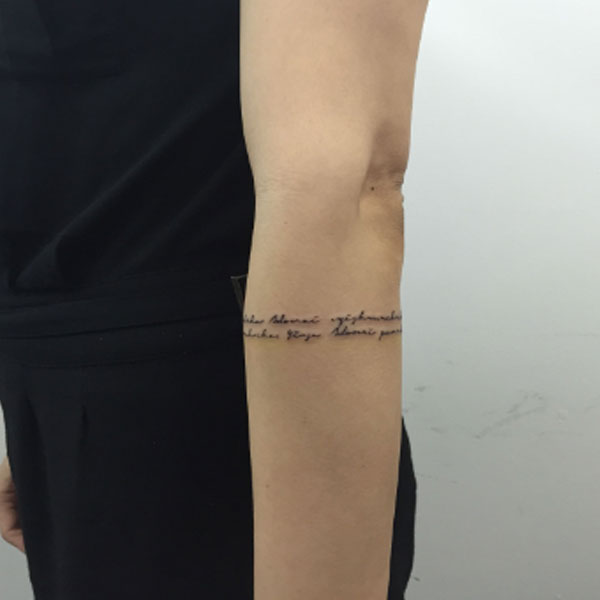 quotation armband tattoo