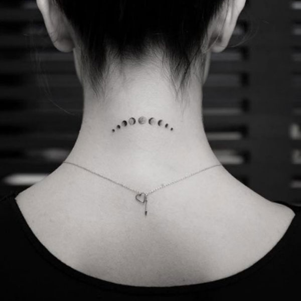 small moon eclipse tattoo for back neck