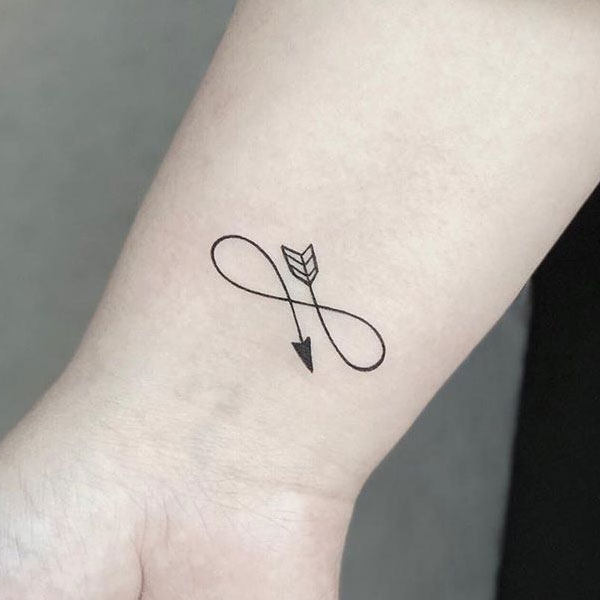 Arrow sign tattoo with infinity style