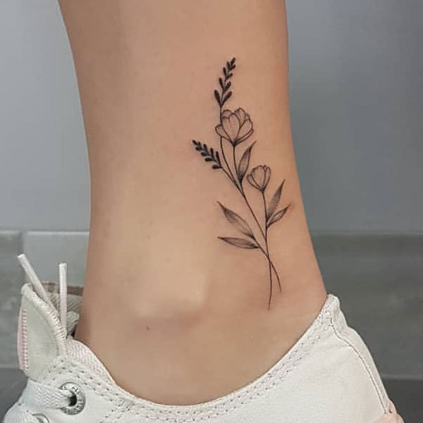Cute black poppy flower line tattoo
