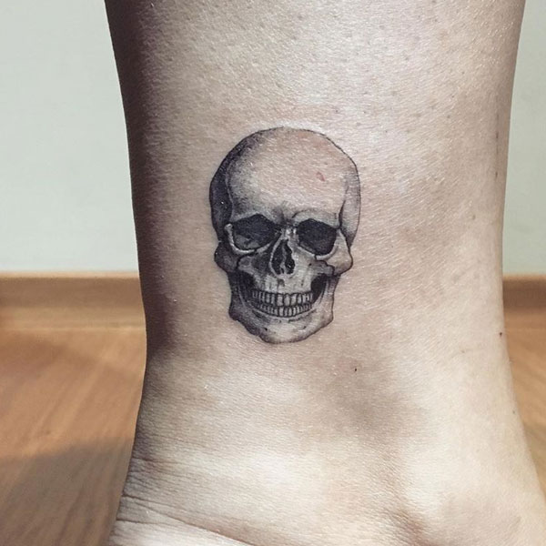 Small skull tattoo on the ankle for boys