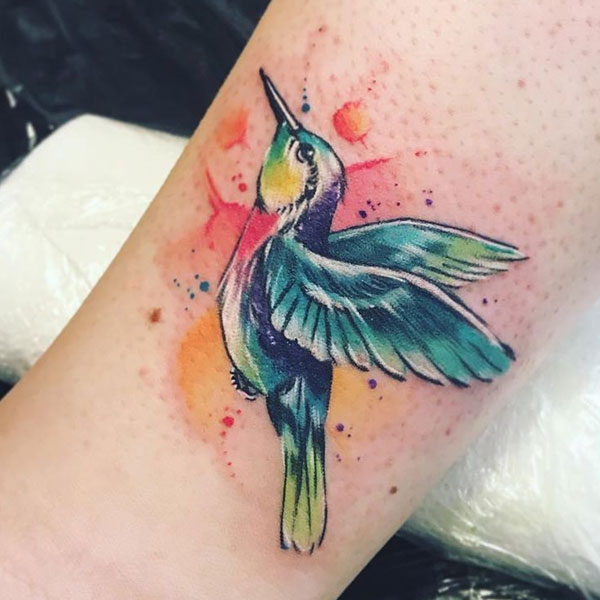 Attractive small colorful bird tattoo