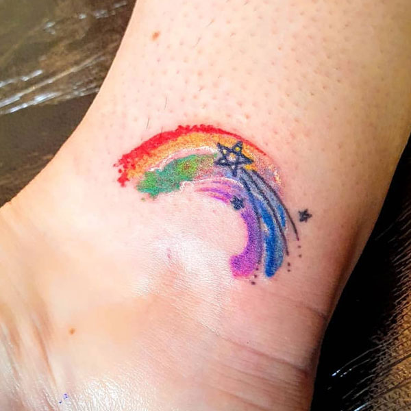 Minimal rainbow small star tattoo for ankle