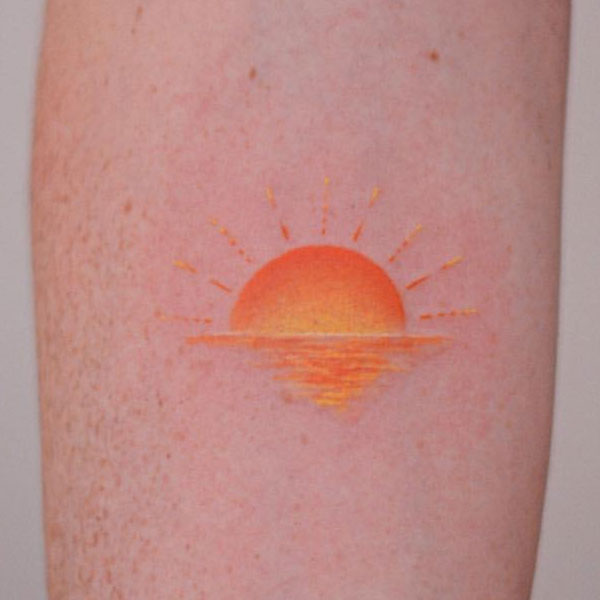 Small colorful sun tattoo
