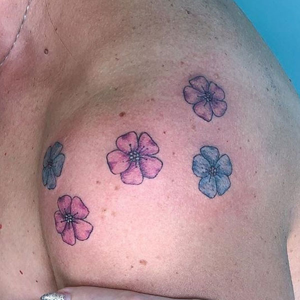  Small colorful flower tattoo