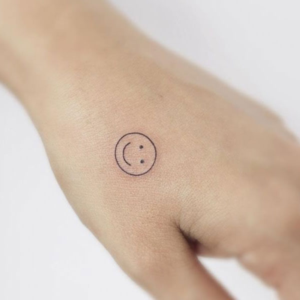 Simple cute mini black smile tattoo