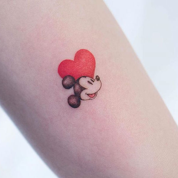 Charming small Mickey mouse tattoo