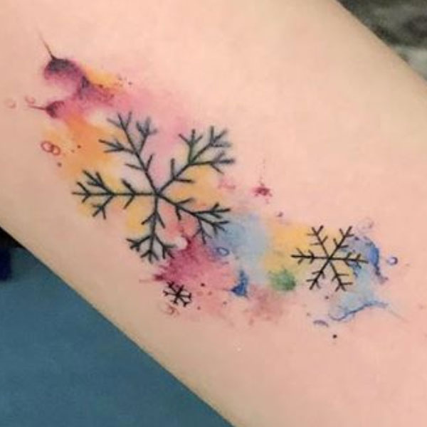 Sexiest snowflake with color splash design tattoo