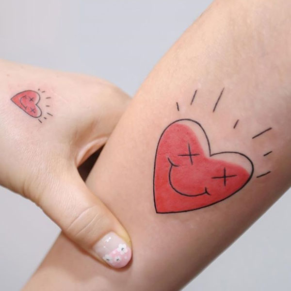 Creative small heart shape smiley tattoo