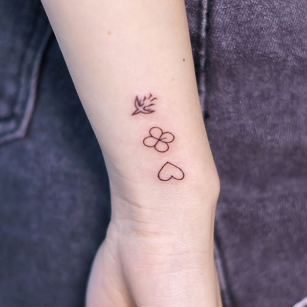 Cute tiny emoji icon tattoo