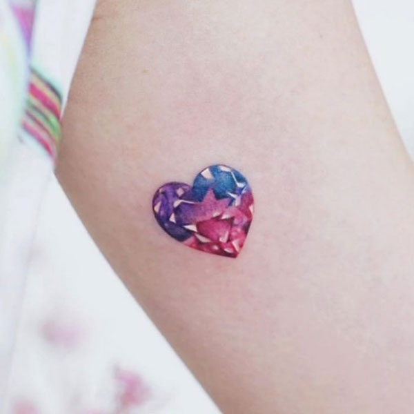 Innovative small diamond style heart tattoo