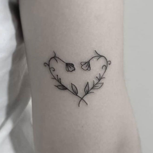 Black beautiful tiny flower vine tattoo