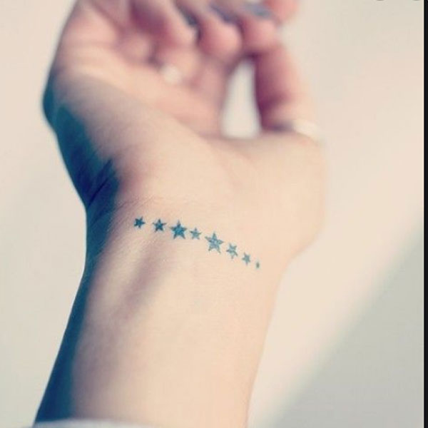  Tiny cute 8-star black tattoo