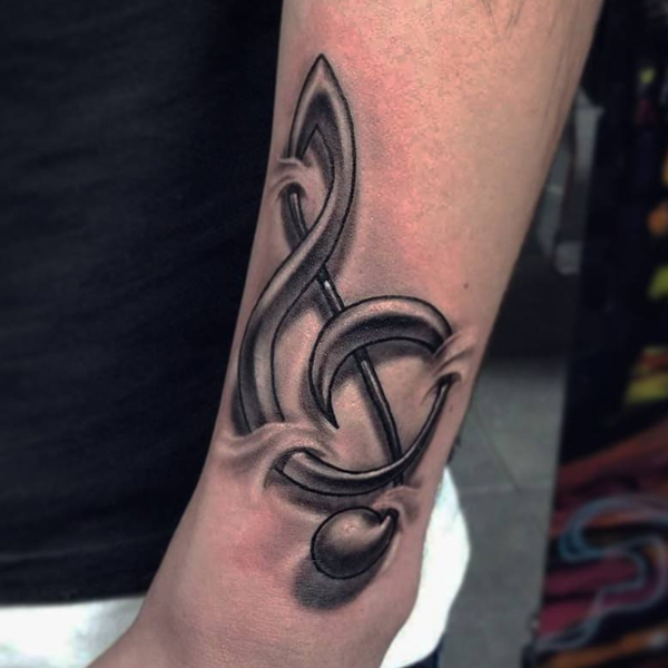 Gorgeous 3D musical note tattoo under the skin