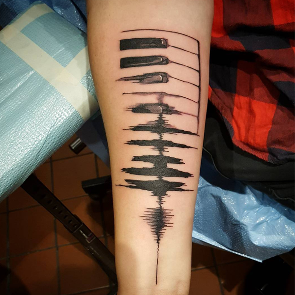 Cool piano keys tattoo for music lovers