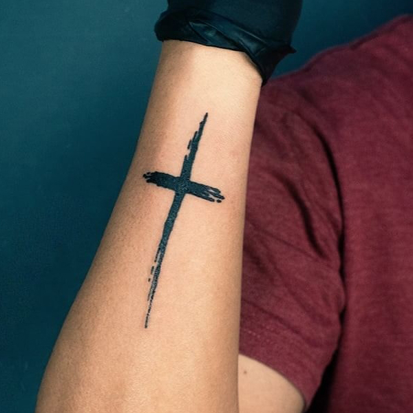 Simple black Cross tattoo 