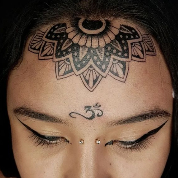 Awesome om tattoo on the third eye 
