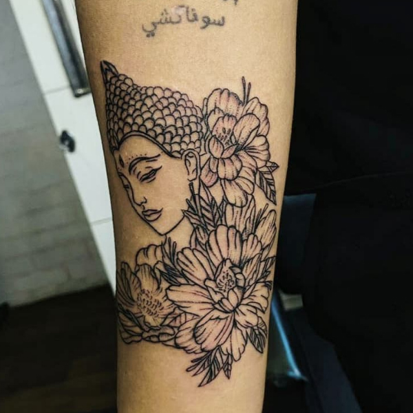 Pretty buddha and peony flower tattoo on the hand