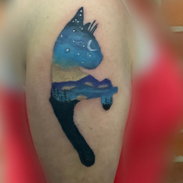 A whole universe in the cat image tattoo