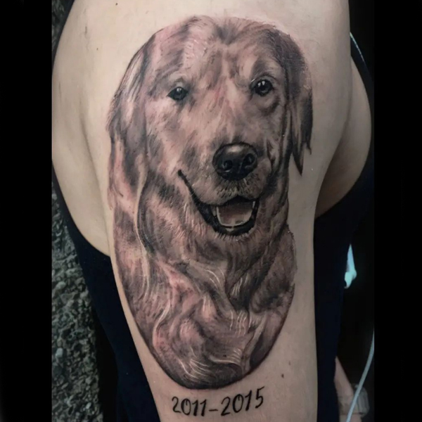 Pretty Dog portrait on bicep tattoo