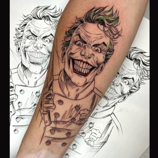 Amazing graphic joker tattoo over the hand