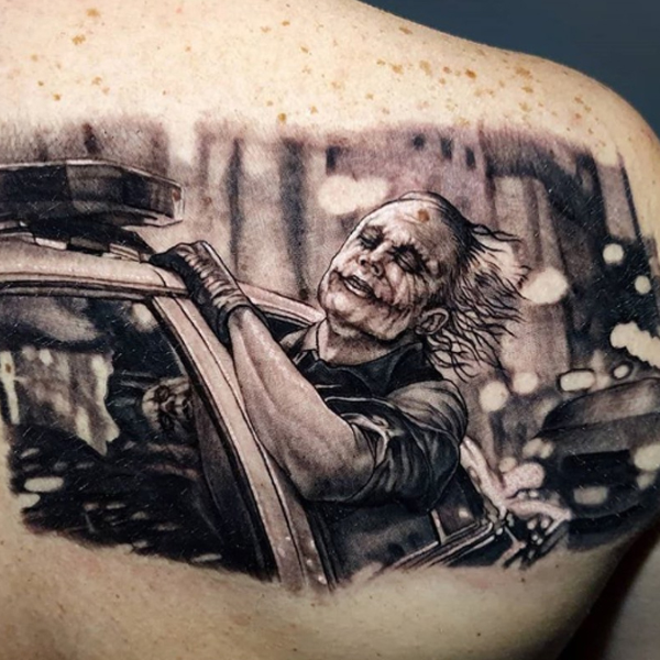 Awesome shot of the movie joker tattoo on the back