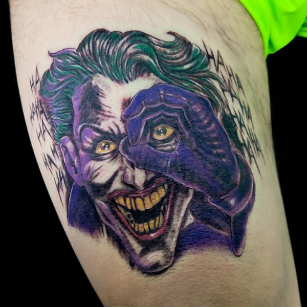 Fabulous joker with devil smile tattoo