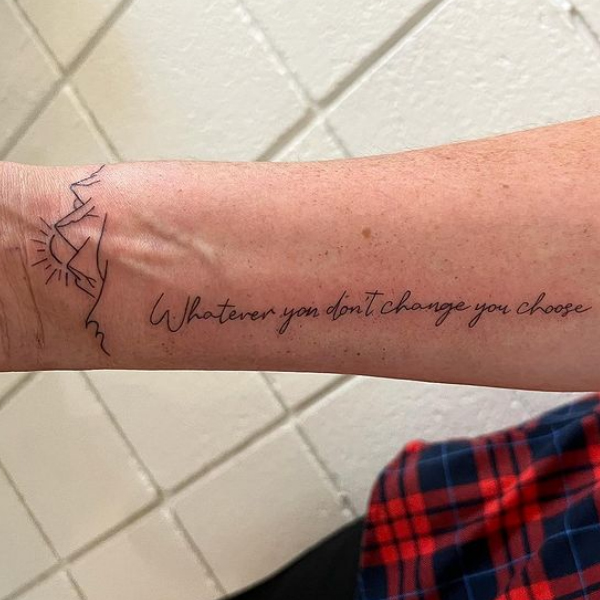 Beautiful combination of mountains and quote tattoo 