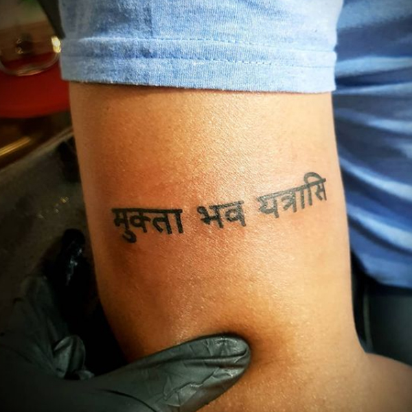 Elegant sanskrit Quote design tattoo on the arm
