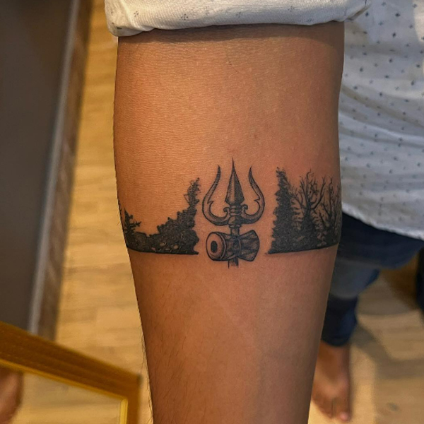 Beautiful trishul and forest armband tattoo design