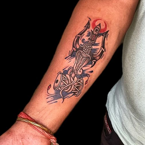 Stunning trishul and snake with damru tattoo design