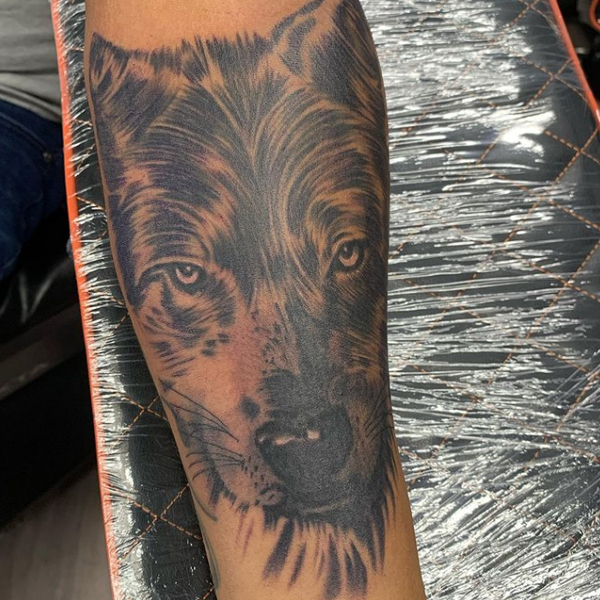 A large Wolf face tattoo