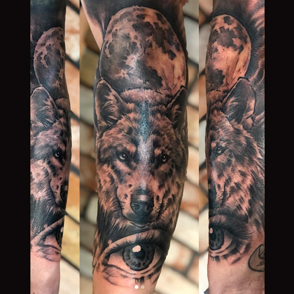 Attractive Wolf and moon tattoo design