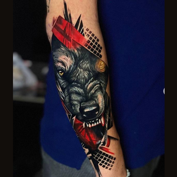  Creative trash polka wolf growling tattoo on the arm