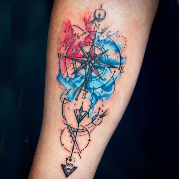Awesome compass watercolor splash tattoo