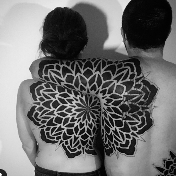 A large mandala matching tattoo