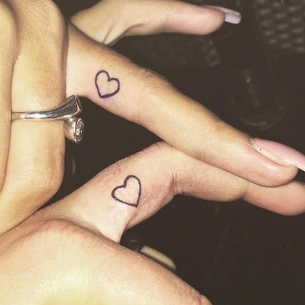 Cute minimal heart finger tattoo for men and women