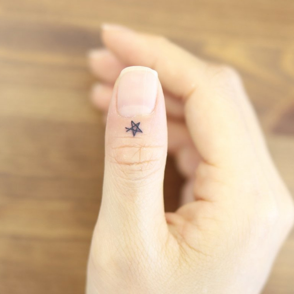 Minimal star tattoo