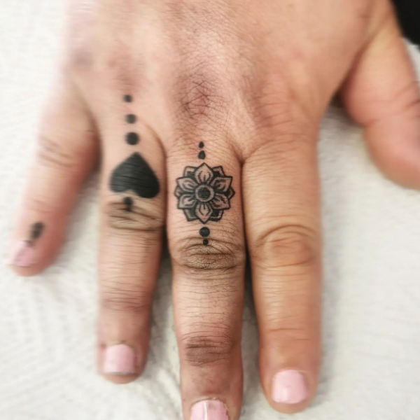 Black mandala and heart tattoo