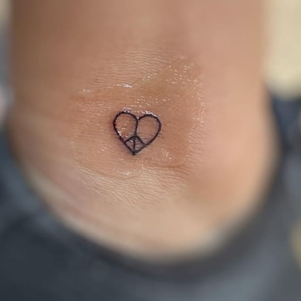 Cute meaningful tattoo of peace and love