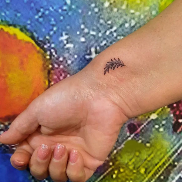 Little leaf tattoo on hand