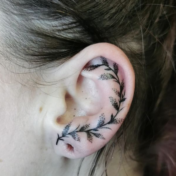 Attractive dot work vine tattoo