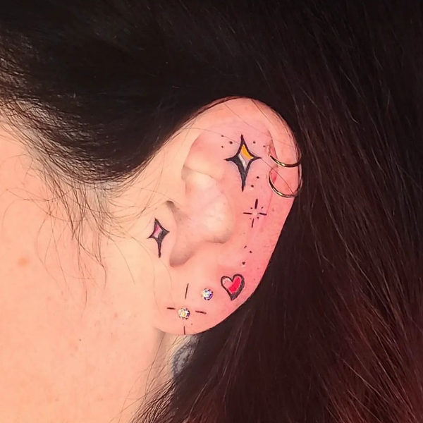 Colorful trendy small star tattoo