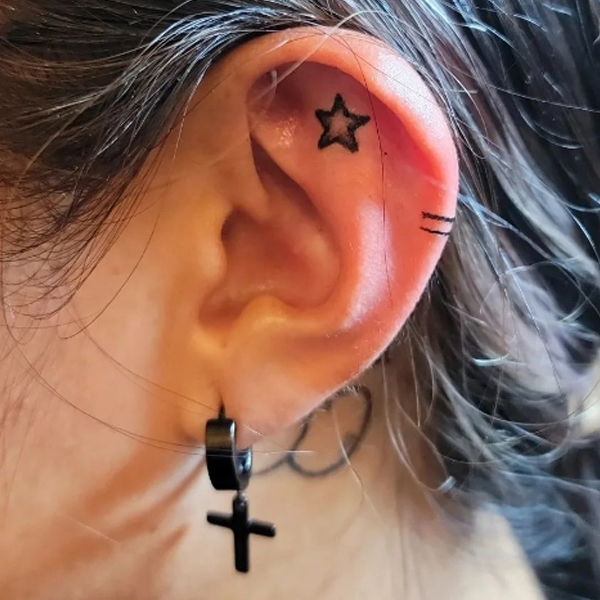 Tiny cute Star tattoo