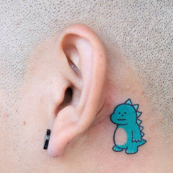 Little cute Dino behind the ear