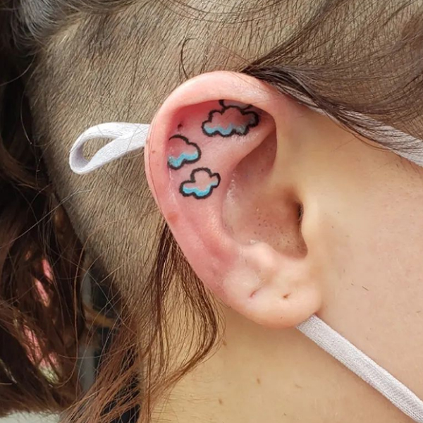 Minimalist colorful clouds ear tattoo