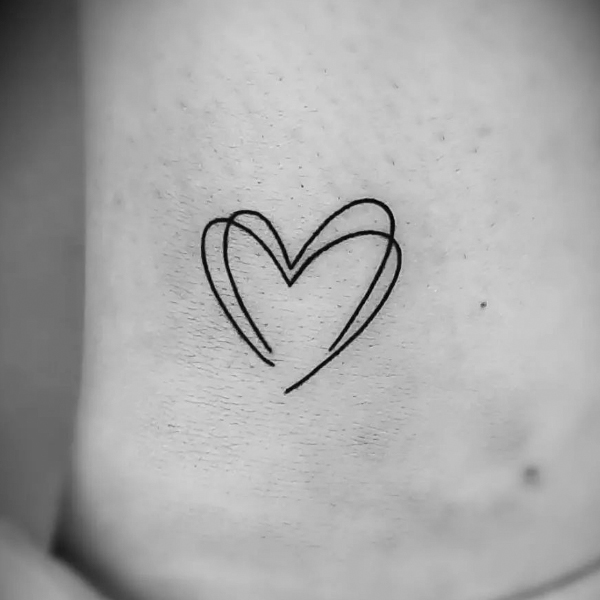 Beautiful fine line small heart tattoo