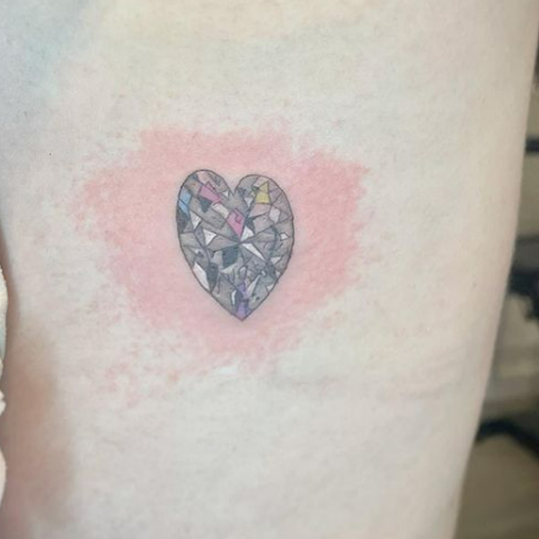  Pretty stone heart design tattoo