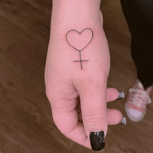Pretty fine line heart cross tattoo